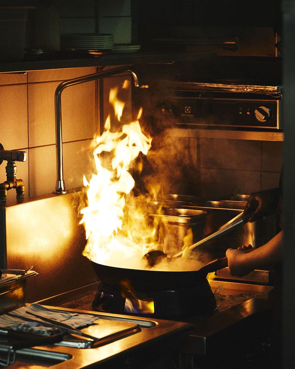 Flames rising from the wok
